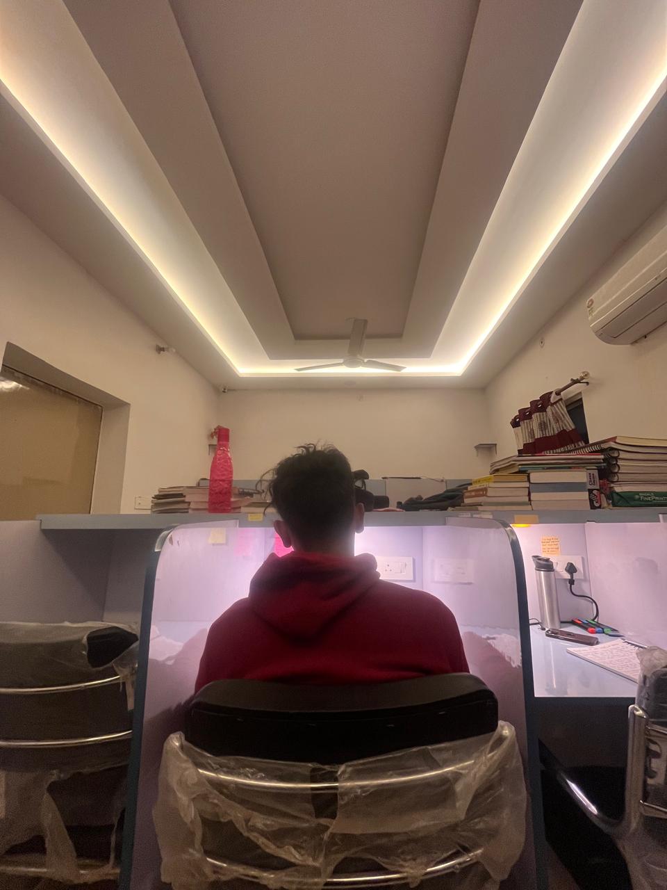 Student studying in quiet cubicle at Shyam Library